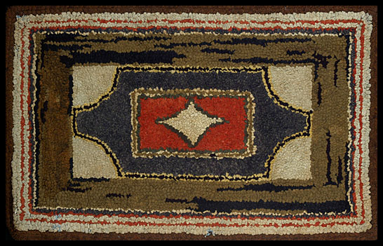 Red, Blue, and Brown Hooked Rug With Center Diamond